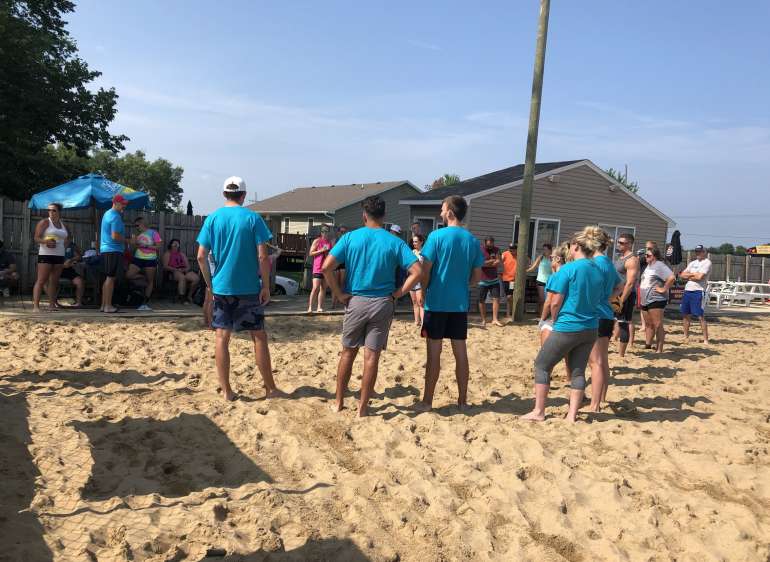 A team of volleyball players on the sand